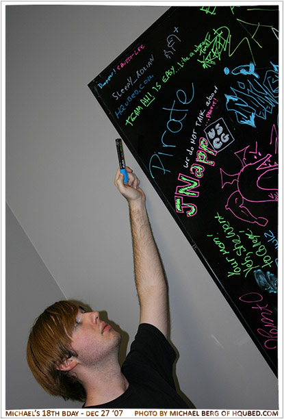 Graffiti
Adrian signs the Hard Knocks board with his duck sign and the HQubed tag
