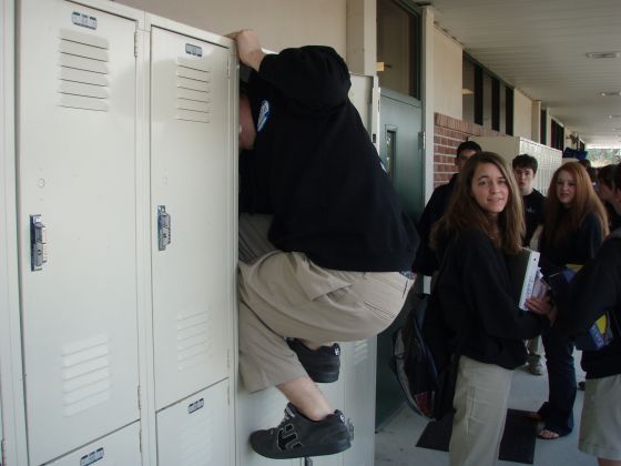 Mac inside his locker
Lynn kinda stares in disgust as her boyfriend jumps into his locker like a monkey

