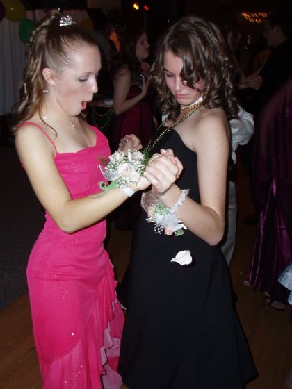 Flower oops!
Brittany and Kyla get their corsages stuck together at the masquarade ball
