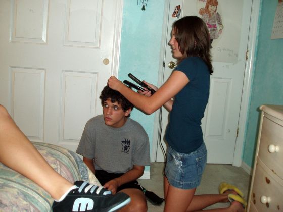 Chris' hair straightened
Brittany using her flat iron to straighten Chris' hair for the first, and last, time
